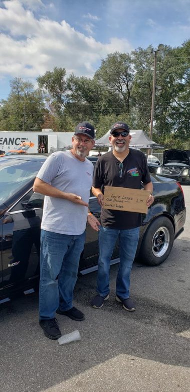 Cadillac Attack 21 at Orlando Speed World Cal Hartline and Louie Lopez with his gag prize